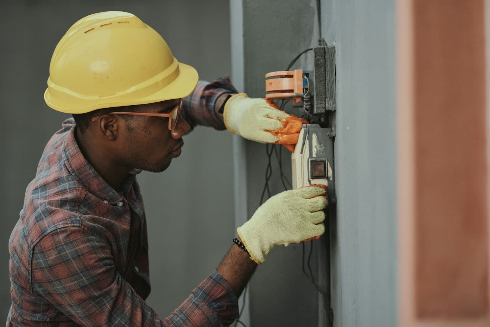 Electrician installing electrical conduit on a job site